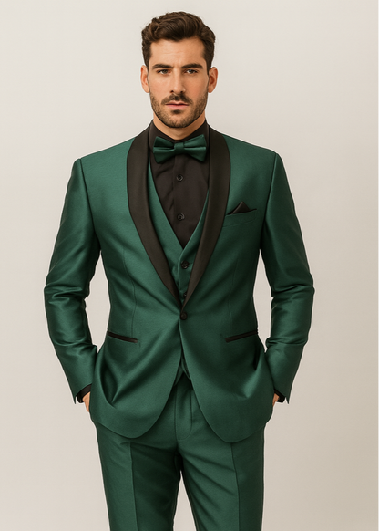 Green suit with black lapels and bow tie worn by a man on a plain background